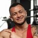 portrait-of-man-bodybuilder-in-red-shirt-in-gym-TF7ZQWD.jpg